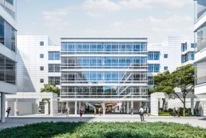 Modern glass-front office building with a central glass atrium, people walking along a courtyard lined with trees and greenery.